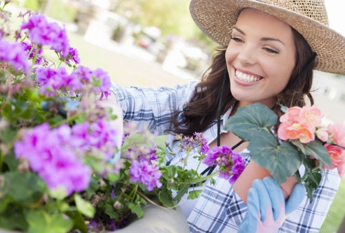 Professional gardener using equipment with care